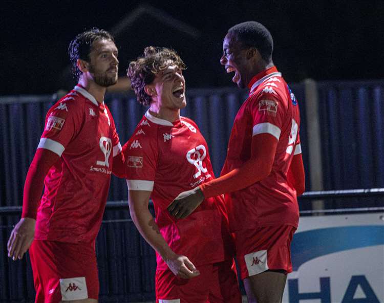 Harry Hudson celebrates his goal with Faversham Town team-mates Jack Steventon and Eniye Amgbaduba during a midweek 4-2 Isthmian South East derby success at Deal. Picture: Nathan Munday