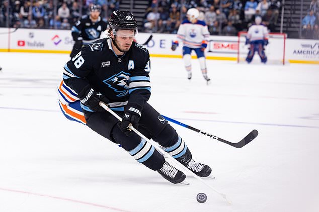 Utah Mammoth defenseman Mikhail Sergachev (98) skates with the puck during the second period of an NHL hockey game against the Edmonton Oilers Saturday, Oct. 17, 2026, in Salt Lake City. (AP Photo/Melissa Majchrzak)