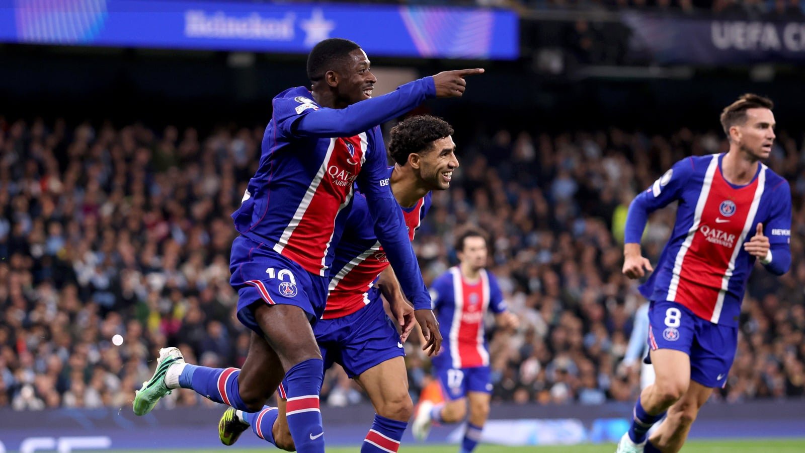 Ousmane Dembele, Achraf Hakimi, and Fabian Ruiz of PSG celeberate their team's goal against Man City at Etihad Stadium, Manchester on October 14, 2026