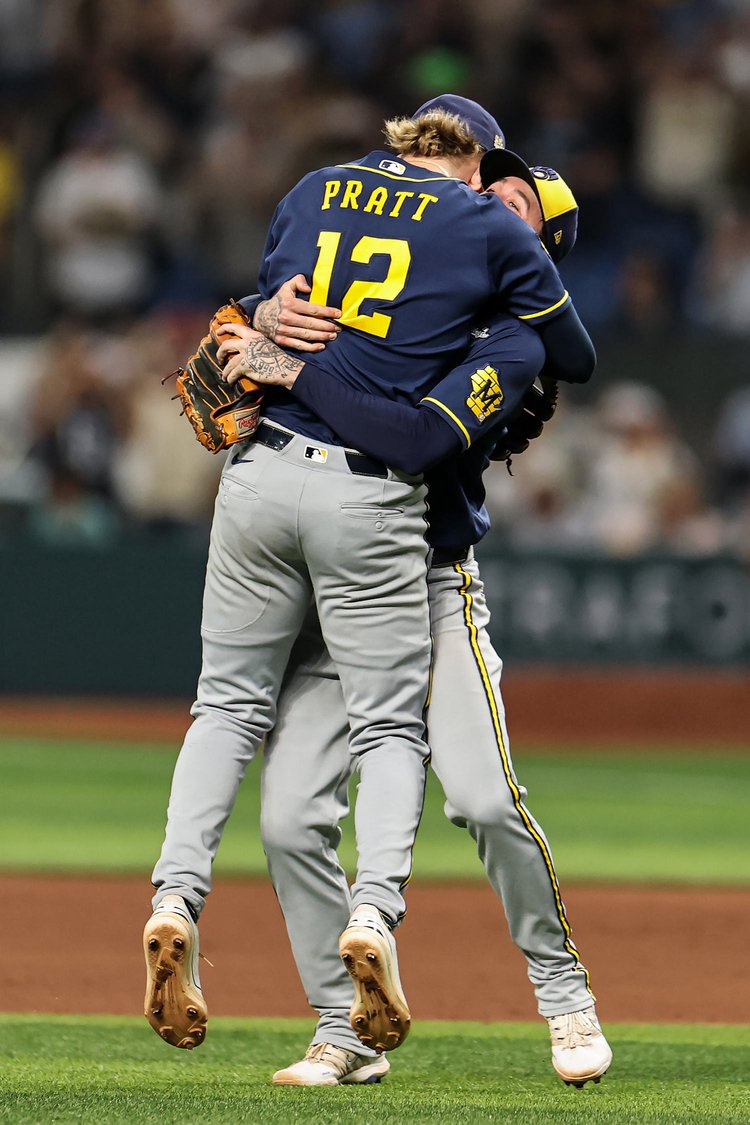 Cooper Pratt #12 and Brice Turang #2 of the Milwaukee Brewers  (Carmen Mandato / Getty)