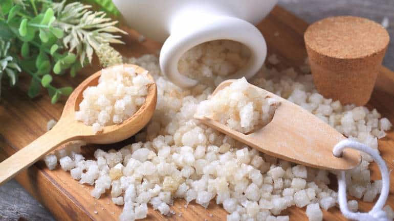 Epsom salt: It contains magnesium and sulfate, which help improve circulation and ease muscle tension. Soaking your feet in warm water with Epsom salt can soften the skin and aid in exfoliation, making it easier to remove dead skin and smooth out rough patches (Image: Canva)