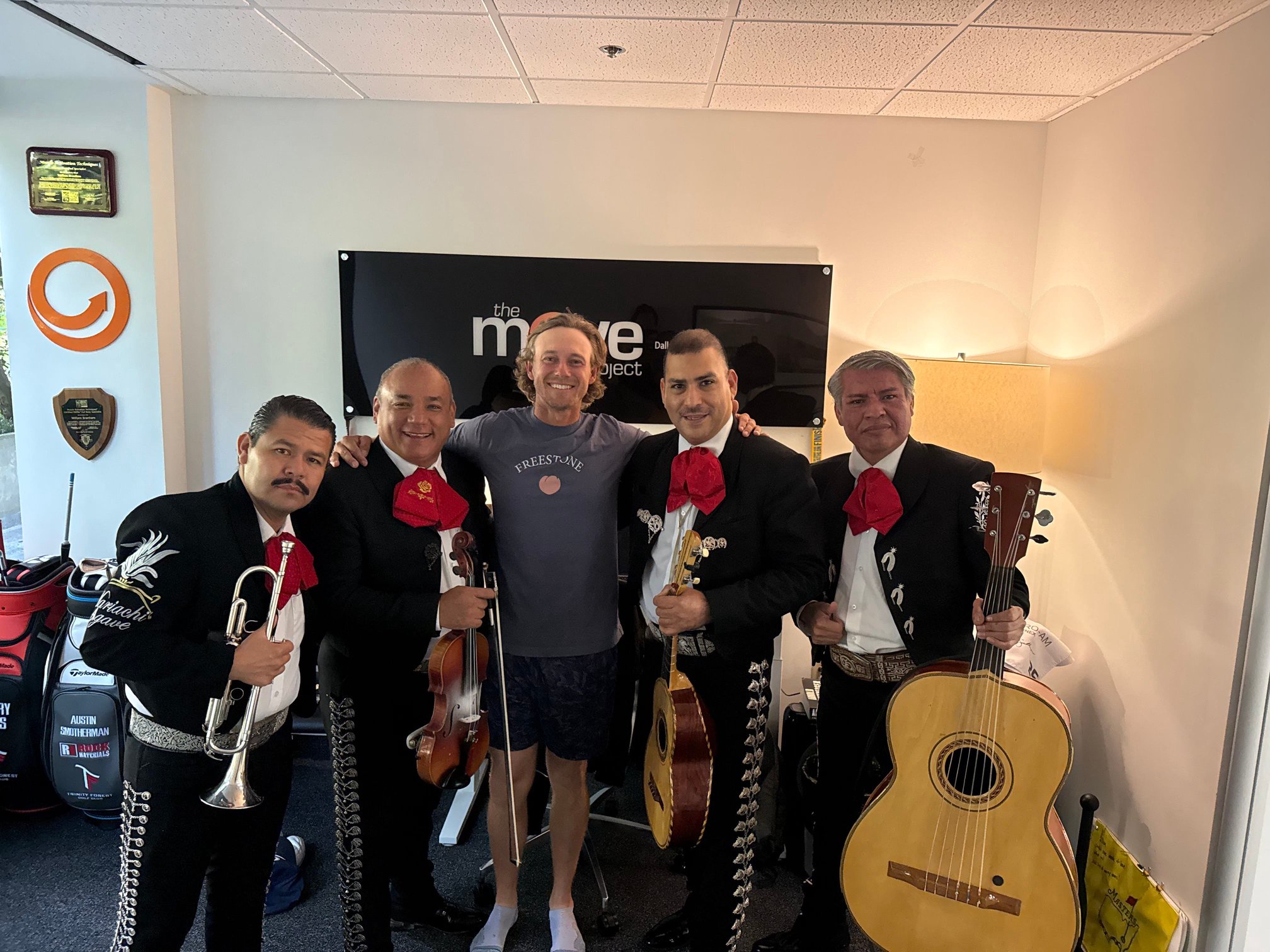 Austin Smotherman, center, was at his local gym when a friend surprised him with a local mariachi band to celebrate his first victory on the PGA Tour at the Bank of Utah Championship.