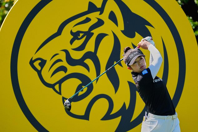 Miyu Yamashita of Japan watches a ball on the 3rd hole during the second day of LPGA Maybank Championship in Kuala Lumpur, Malaysia, Friday, Oct. 30, 2026. (AP Photo/Vincent Thian)