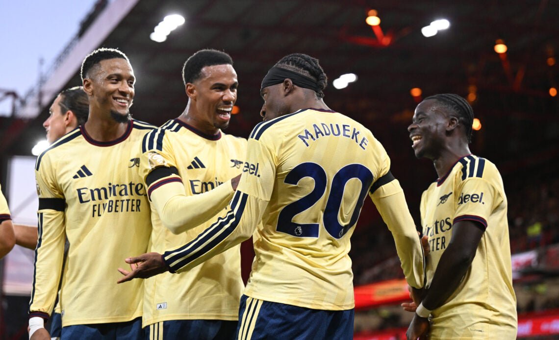 Arsenal players celebrate with Noni Madueke after his goal