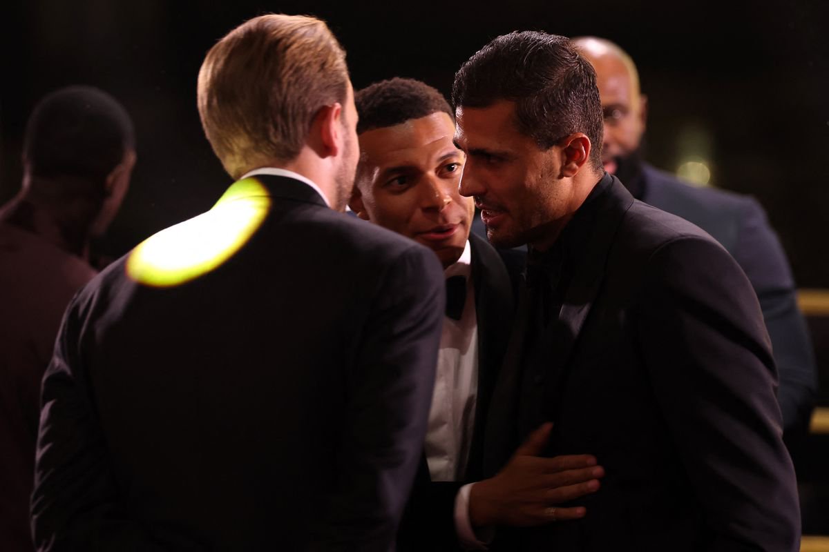 Kylian Mbappe talks to Spain and Barcelona midfielder Rodri and England and Bayern Munich forward Harry Kane 