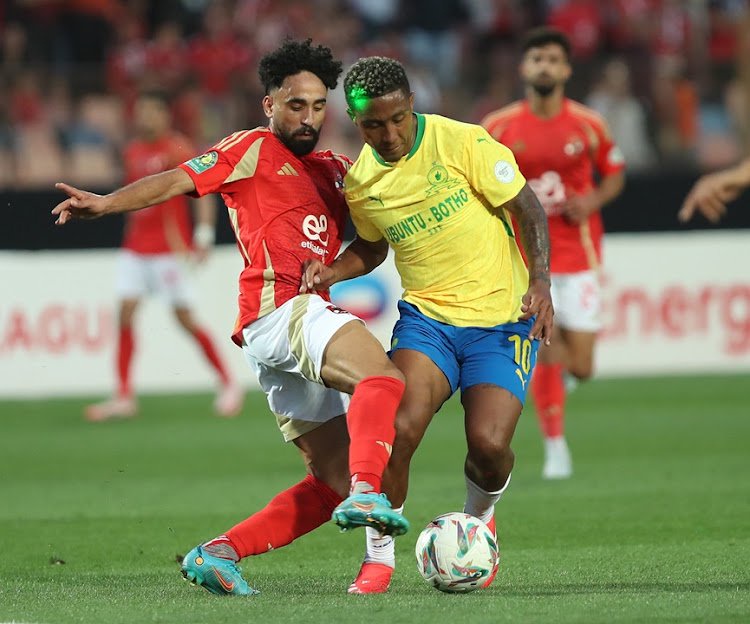 Marwan Attia of Al Ahly challenges Lucas Ribeiro of Mamelodi Sundowns during their Caf Champions League semifinal second leg at Cairo International Stadium.