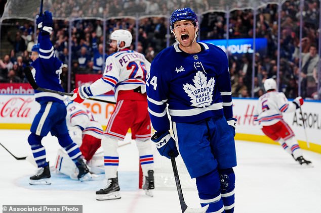 Toronto Maple Leafs' Brandon Duhaime (24) celebrates after his goal against the New York Rangers during the second period of an NHL hockey game in Toronto, Thursday, Oct. 22, 2026. (Frank Gunn/The Canadian Press via AP)