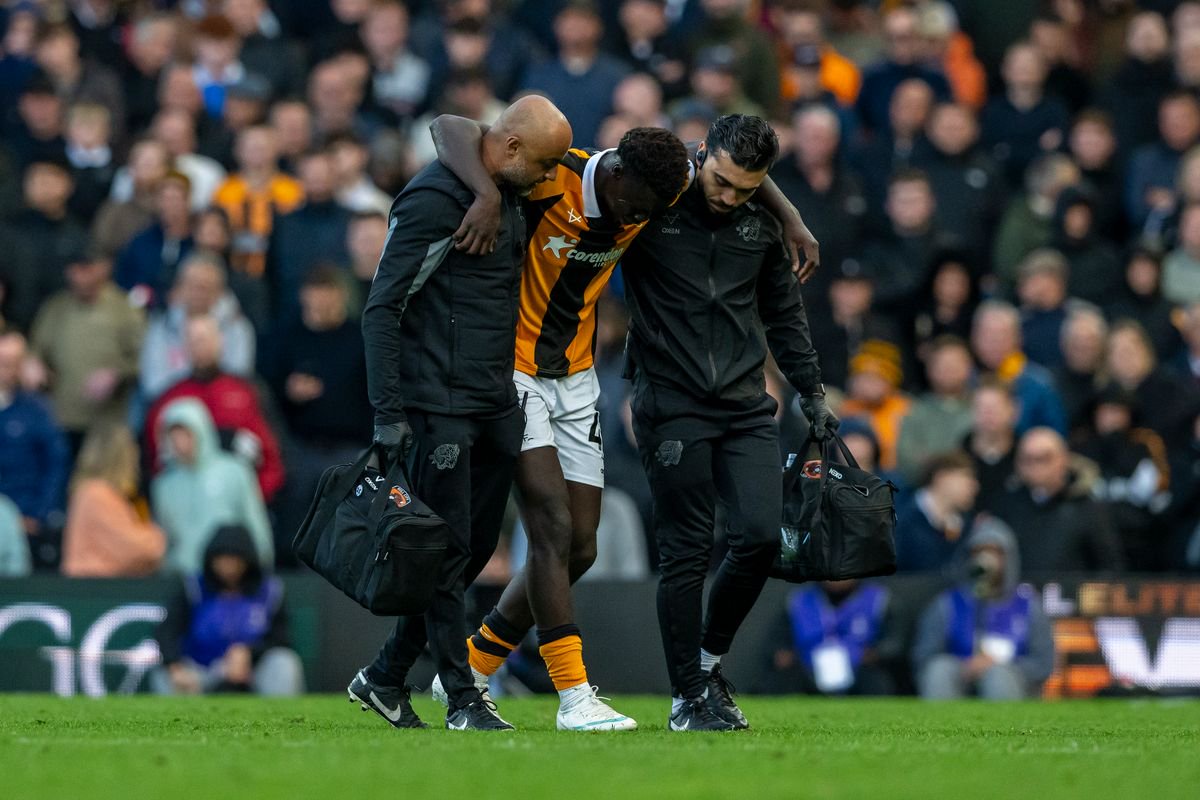 Robinio Vaz leaves the pitch flanked by City's medical staff