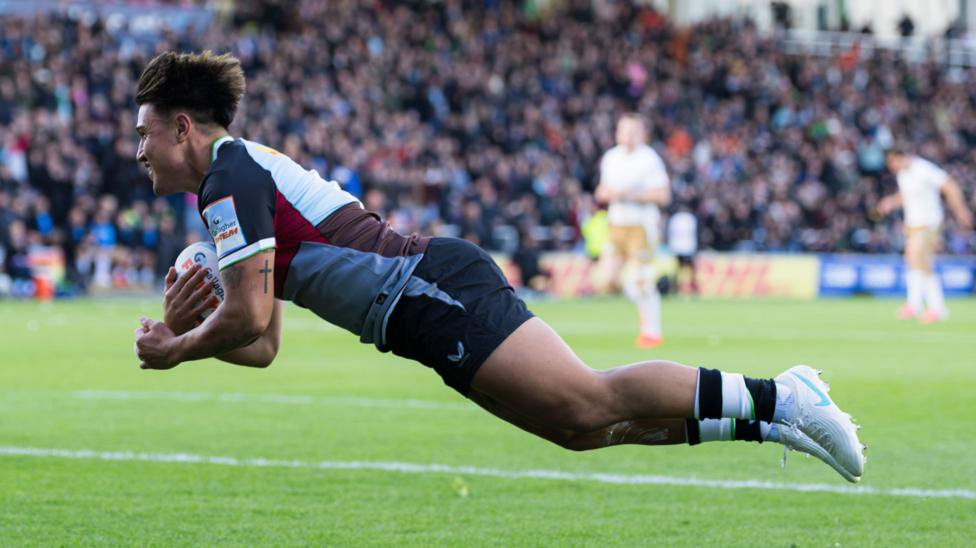 Marcus Smith dives over the line for the opening Harlequins try against Saracens
