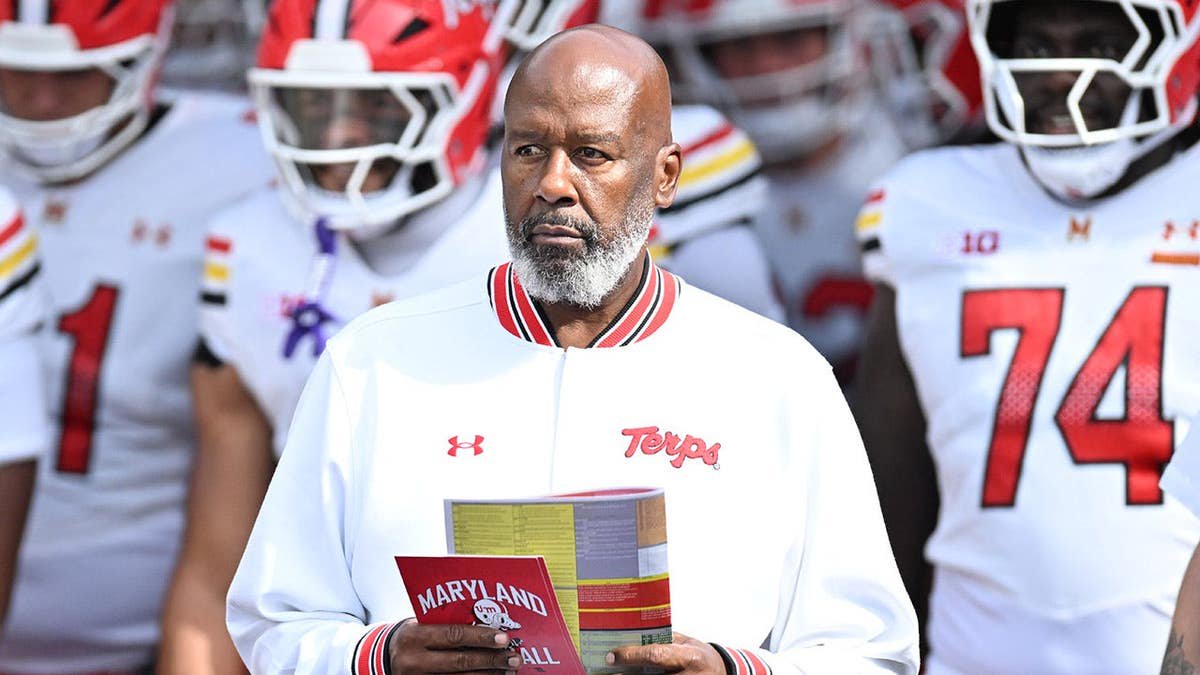 Mike Locksley leads Maryland Terrapins onto the field at Pratt & Whitney Stadium.