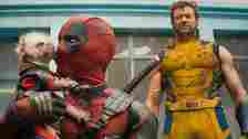 Deadpool kisses Dogpool to Wolverine's disgust.