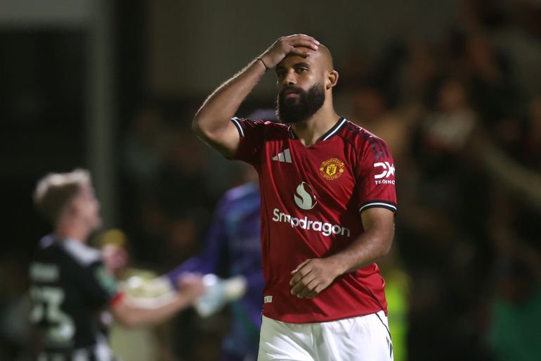 GRIMSBY, ENGLAND - AUGUST 27: Bryan Mbeumo of Manchester United looks dejected after missing his teams thirteenth penalty during the Carabao Cup Second Round match between Grimsby Town and Manchester United at Blundell Park on August 27, 2025 in Grimsby, England. (Photo by George Wood/Getty Images)