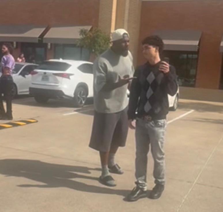 Dez Bryant confronting a teenager in a parking lot.