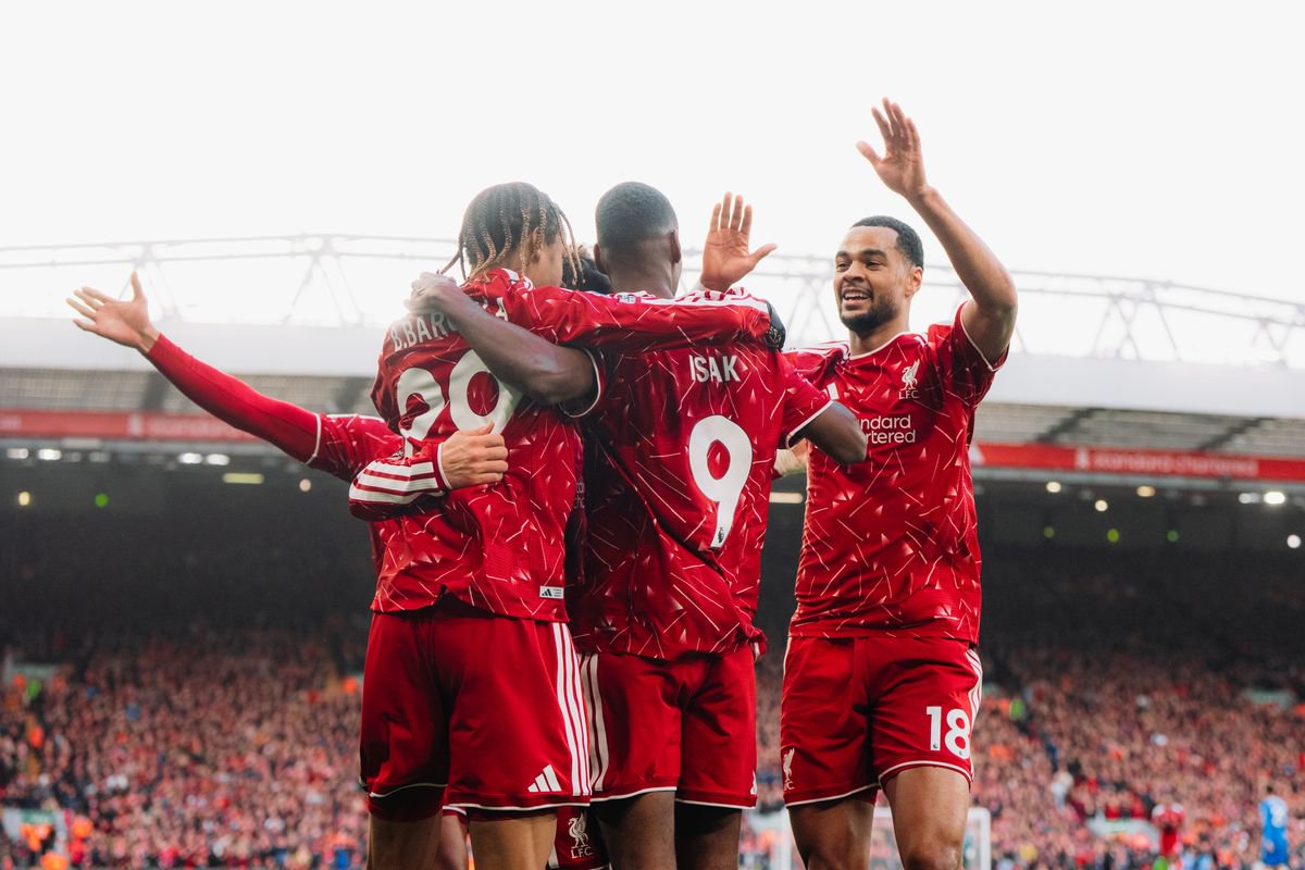 Liverpool players including Cody Gakpo celebrate their second goal against Brighton.