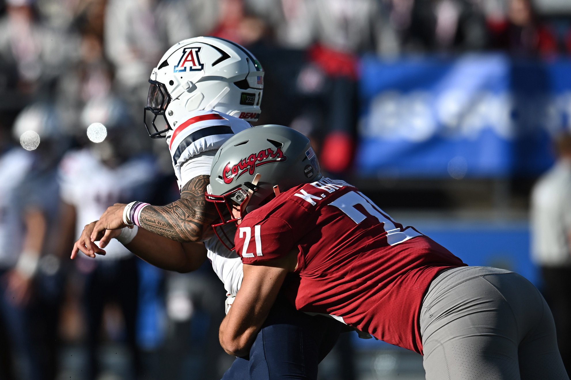 Sep 26, 2026; Pullman, Washington, USA;  Arizona Wildcats quarterback Noah Fifita (1) is hit after the throw by Washington State Cougars linebacker Keith Brown (21) during the first half at Gesa Field at Martin Stadium.  Mandatory Credit: James Snook-Imagn Images