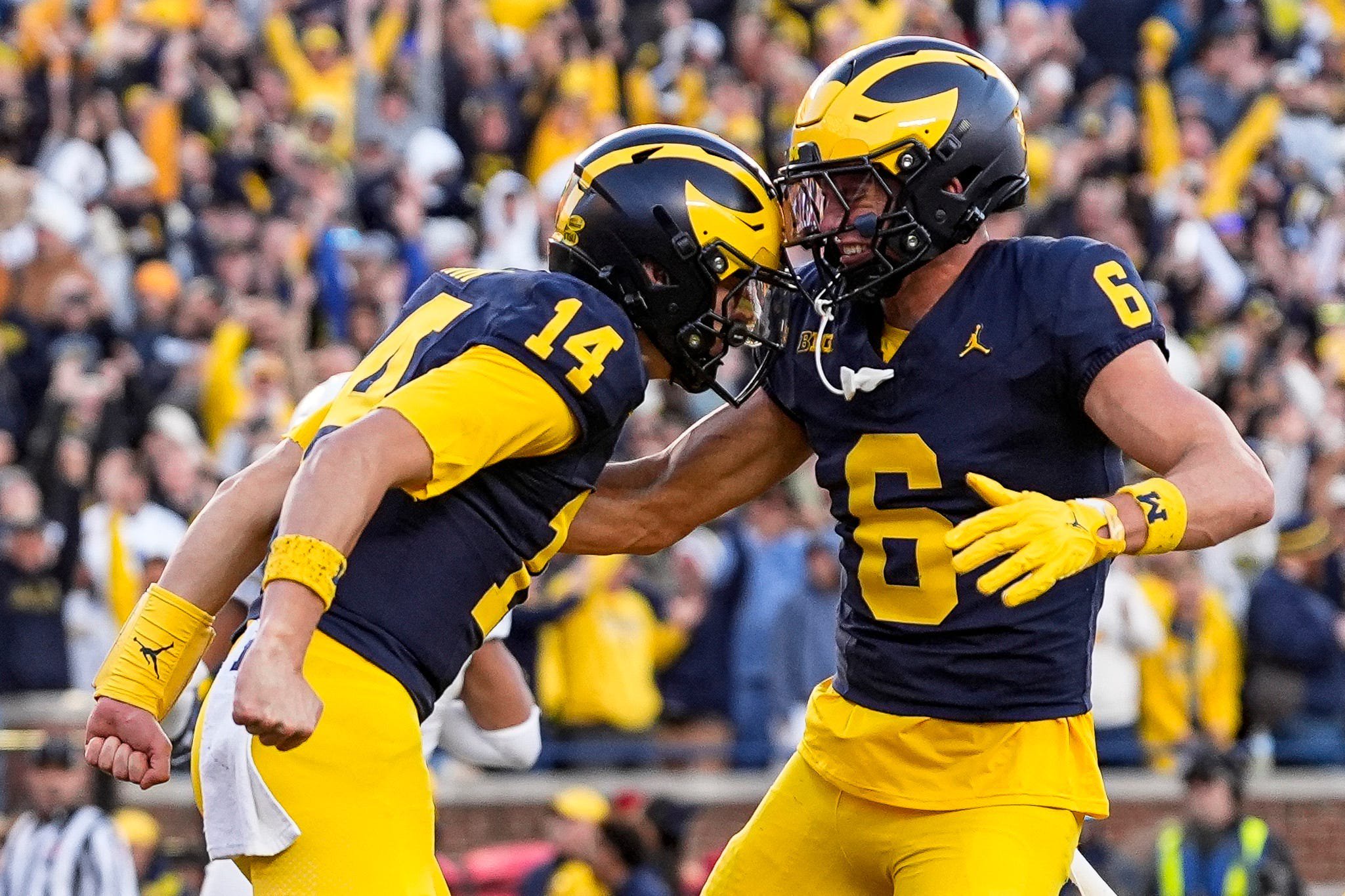 Michigan quarterback Tommy Carr (14), left, celebrates a first down against Penn State with wide receiver JJ Buchanan (6) during the second half at Michigan Stadium in Ann Arbor on Saturday, Oct. 17, 2026.