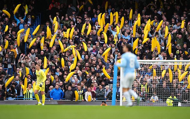 City fans waved inflatable bananas throughout the game (Martin Rickett/PA)