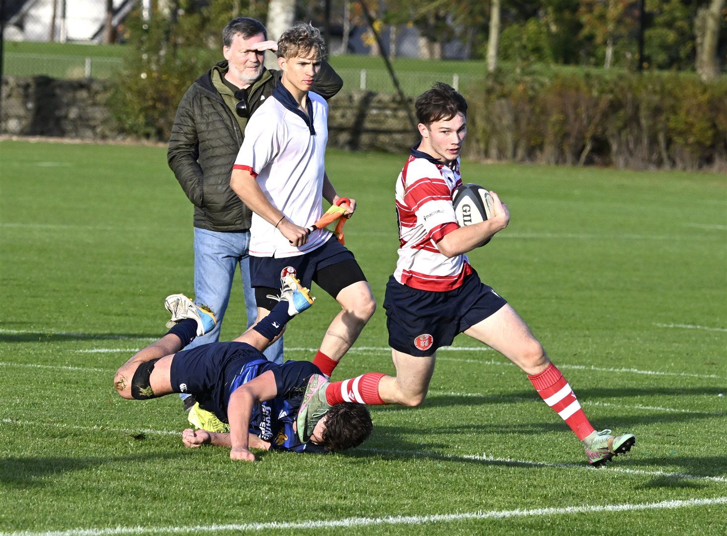 Lewis Hay rounds the winger on his way to another try. Picture: James Officer