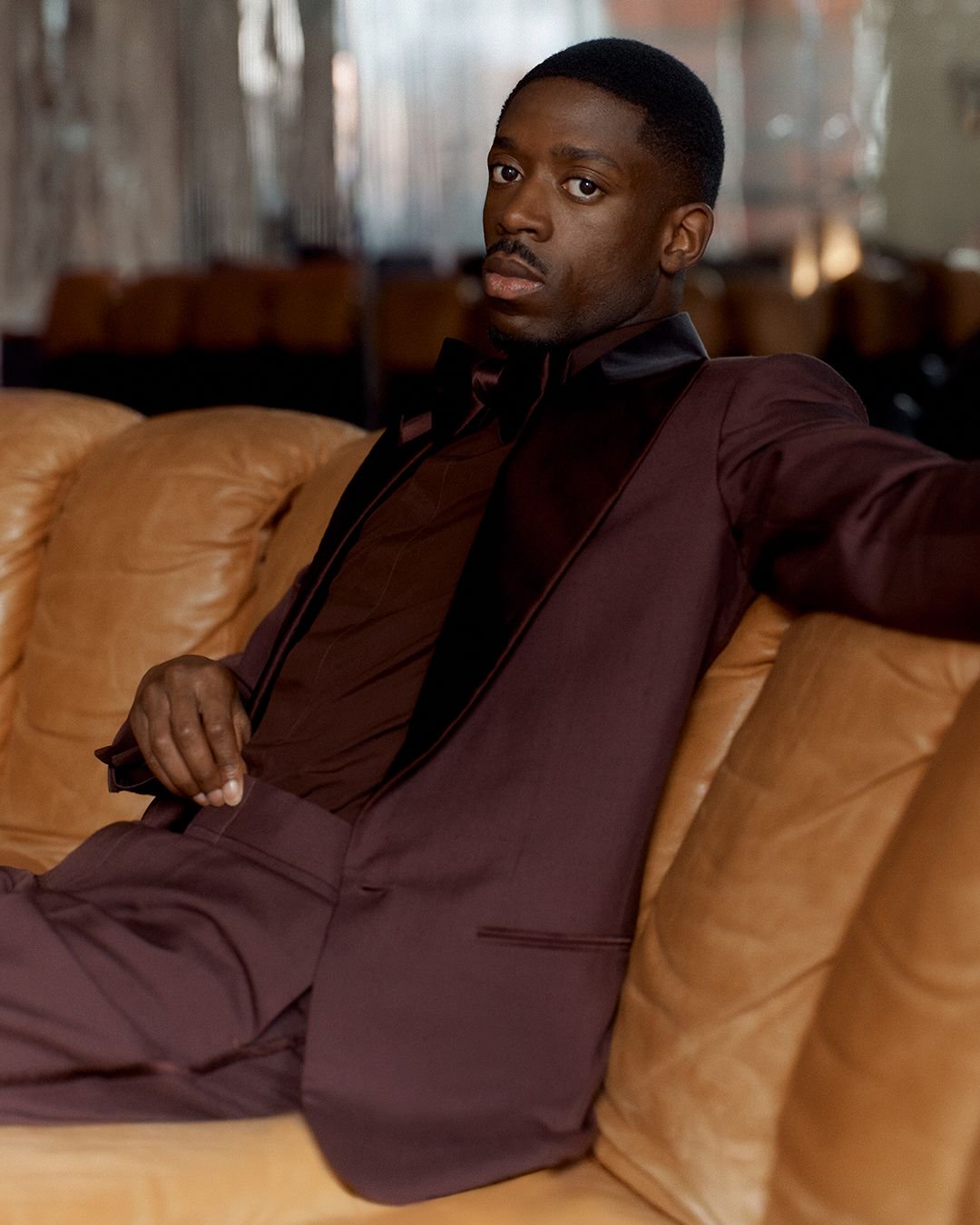 Image may contain Ousmane Dembl Person Sitting Adult Clothing Formal Wear Suit Face and Head