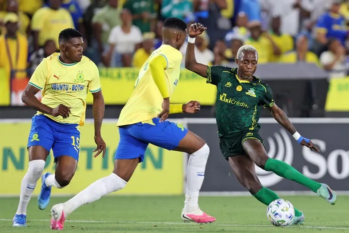 Deivi Miguel Vieira of Wiliete SC challenged by Khulumani Ndamane, right, and Bathusi Aubaas of Mamelodi Sundowns during the CAF Champions League match at Loftus Versfeld Stadium. 