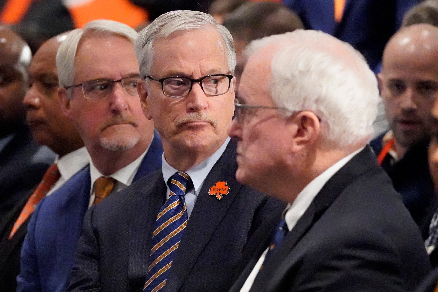 Jan 22, 2025; Lake Forest, IL, USA; Chicago Bears chairman George McCaskey (C) listens as new head coach Ben Johnson answers questions during a introductory press conference at PNC Center. Mandatory Credit: David Banks-Imagn Images