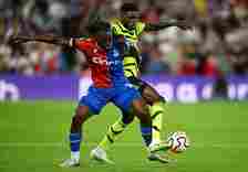 Thomas Partey of Arsenal battles for possession with Eberechi Eze of Crystal Palace during the Premier League match between Crystal Palace and Arse...