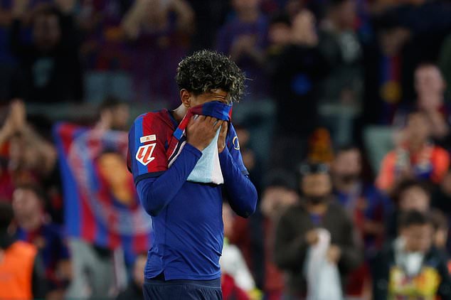 Barcelona's Lamine Yamal reacts at the end of the Spanish La Liga soccer match between FC Barcelona and Real Madrid in Barcelona, Spain, Sunday, Oct. 25, 2026. (AP Photo/Joan Monfort)