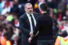 Tottenham Hotspur's Greek-Australian Head Coach Ange Postecoglou (L) shakes hands with Arsenal's Spanish manager Mikel Arteta (R) after the English...