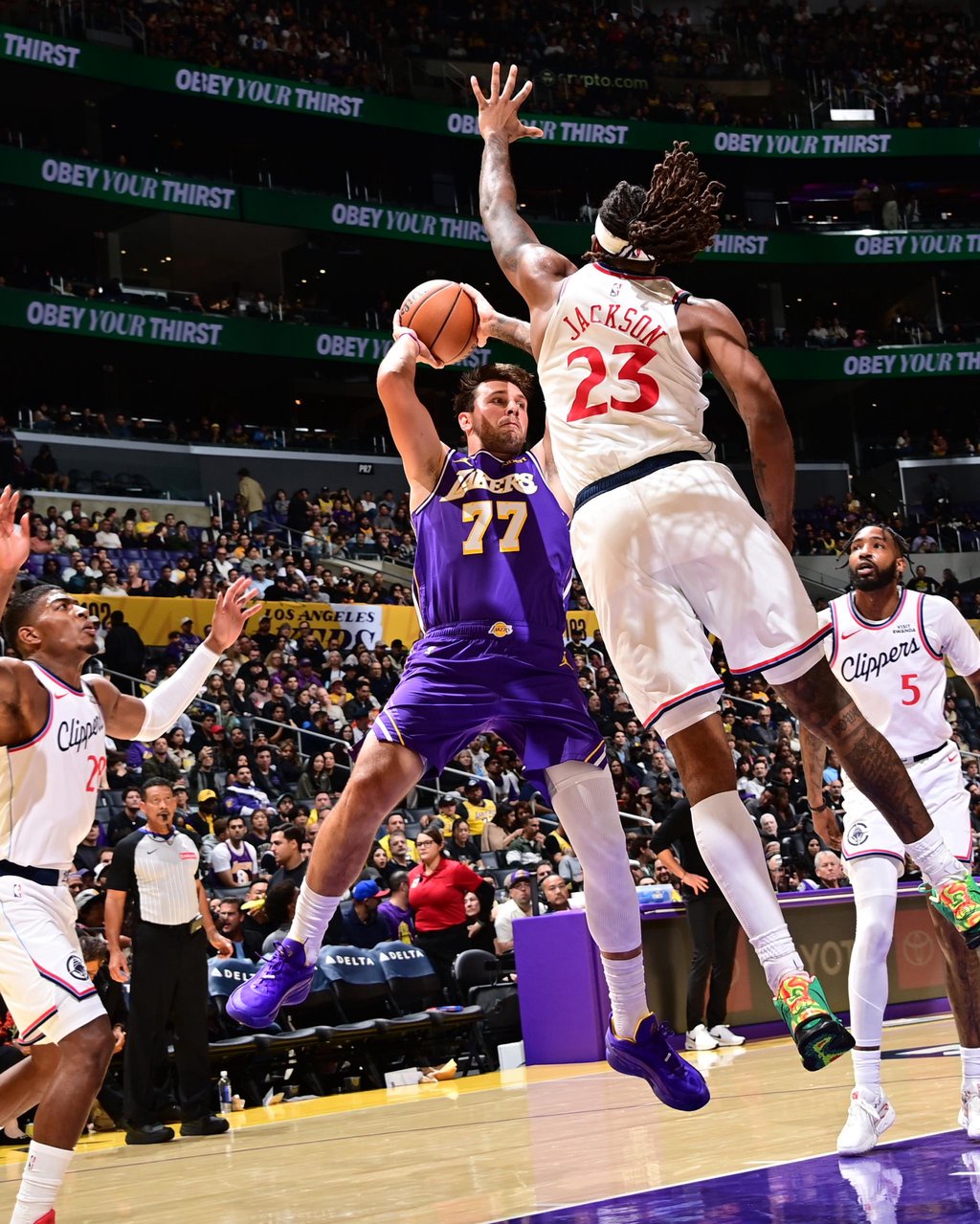Luka Doncic #77 of the Los Angeles Lakers looks to pass the ball during the game against the LA Clippers.