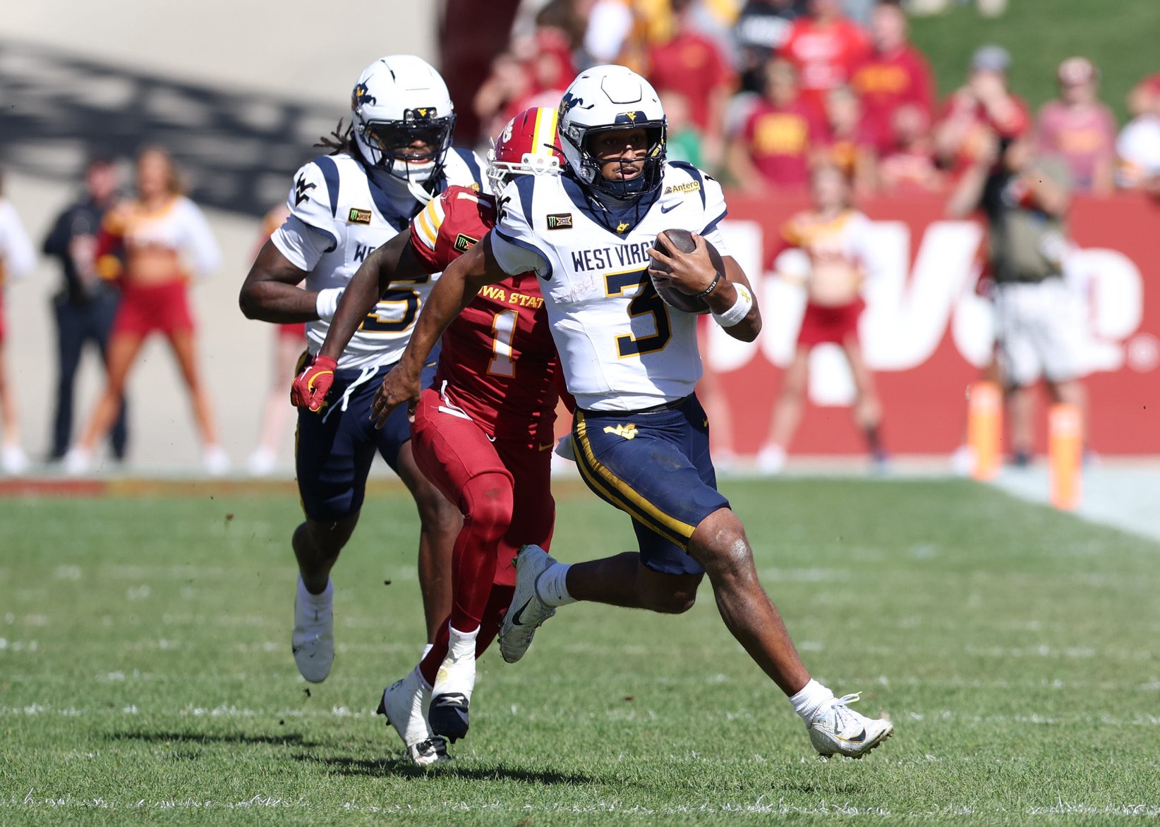 Oct 3, 2026; Ames, Iowa, USA;  Iowa State Cyclones cornerback Keyon Washington (1) chases West Virginia Mountaineers quarterback Michael Hawkins Jr. (3) at Jack Trice Stadium.  Mandatory Credit: Reese Strickland-Imagn Images