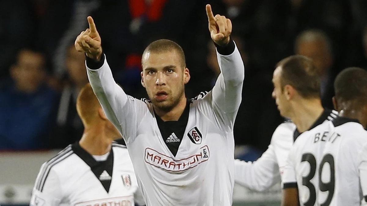 Fulham's Pajtim Kasami, center, celebrates scoring a goal during the English Premier League soccer match between Crystal Palace and Fulham at Selhurst Park Stadium in London, Monday, Oct. 21, 201 ...