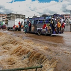 Kenyans collect what’s left of their homes after flash floods