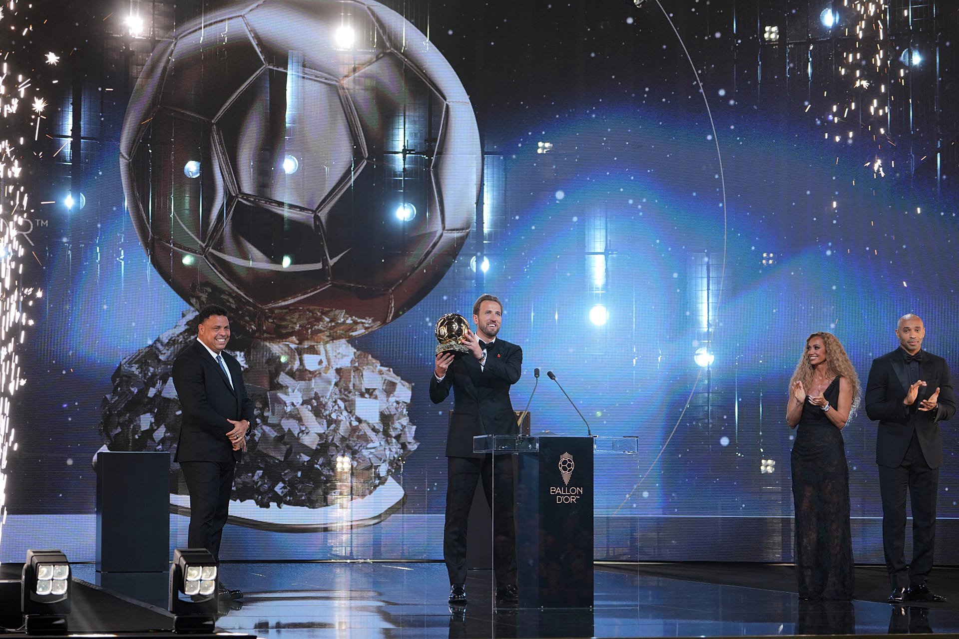 English footballer Harry Kane receives the men's player of the year award during the Ballon d'Or ceremony at the London Palladium Theatre in London.