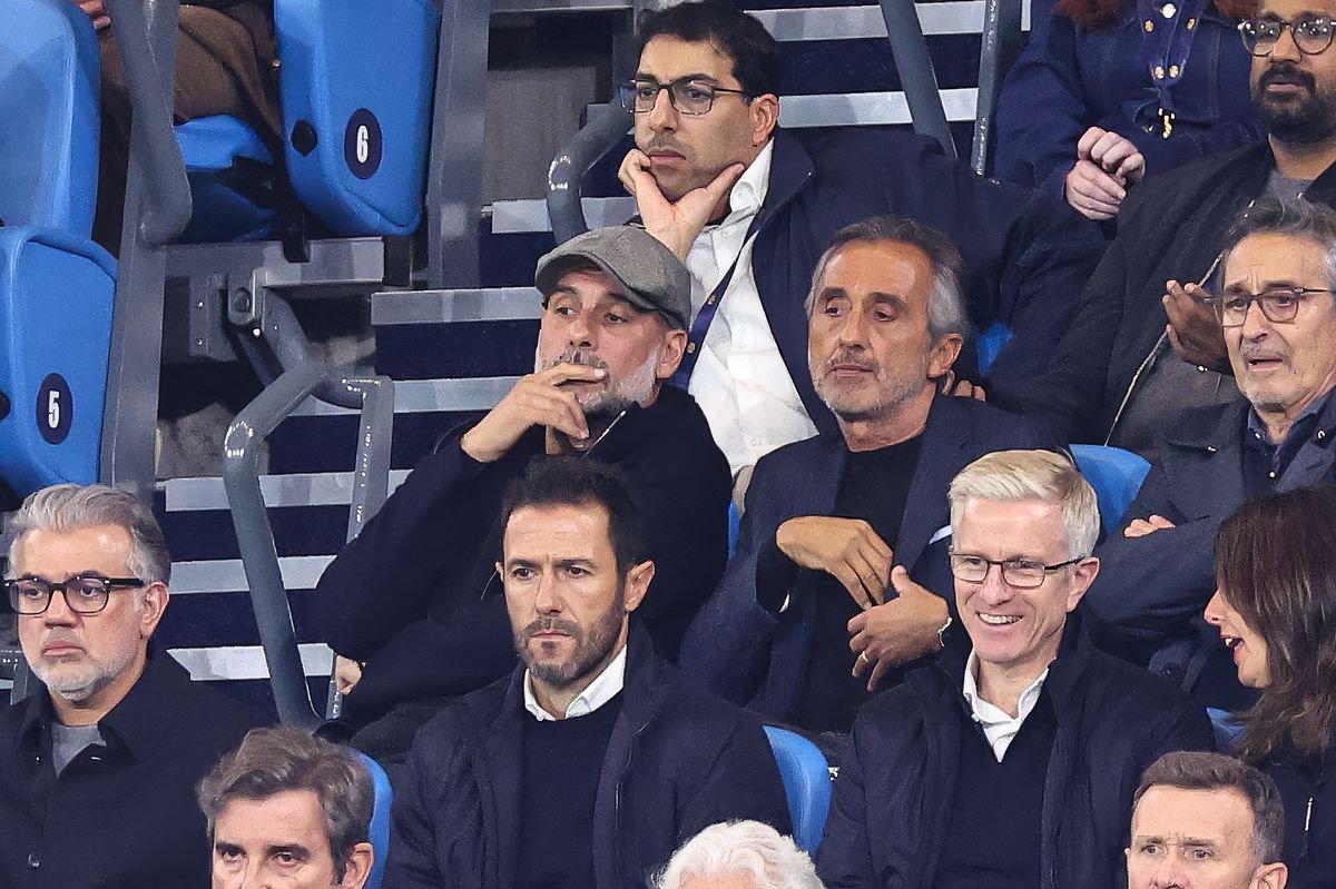 Pep Guardiola watches on from the stands