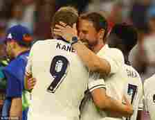 England manager Gareth Southgate and captain Harry Kane embrace following the win