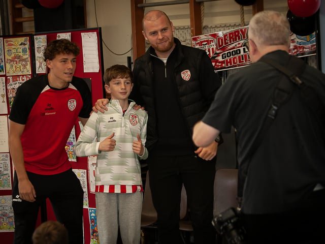 Young Oscar Duffy gets a photo with the Derry City stars on Friday. (Photos: Jim McCafferty Photography)