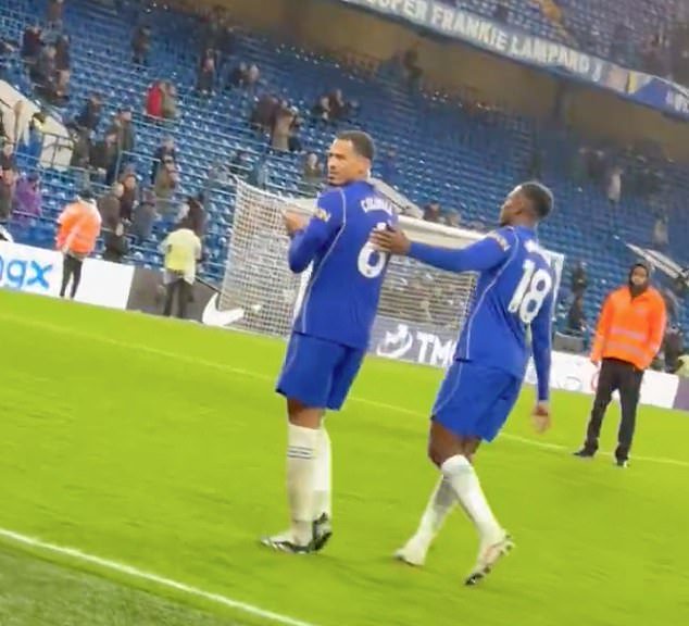 Colwill is led away by Danny Welbeck after the confrontation
