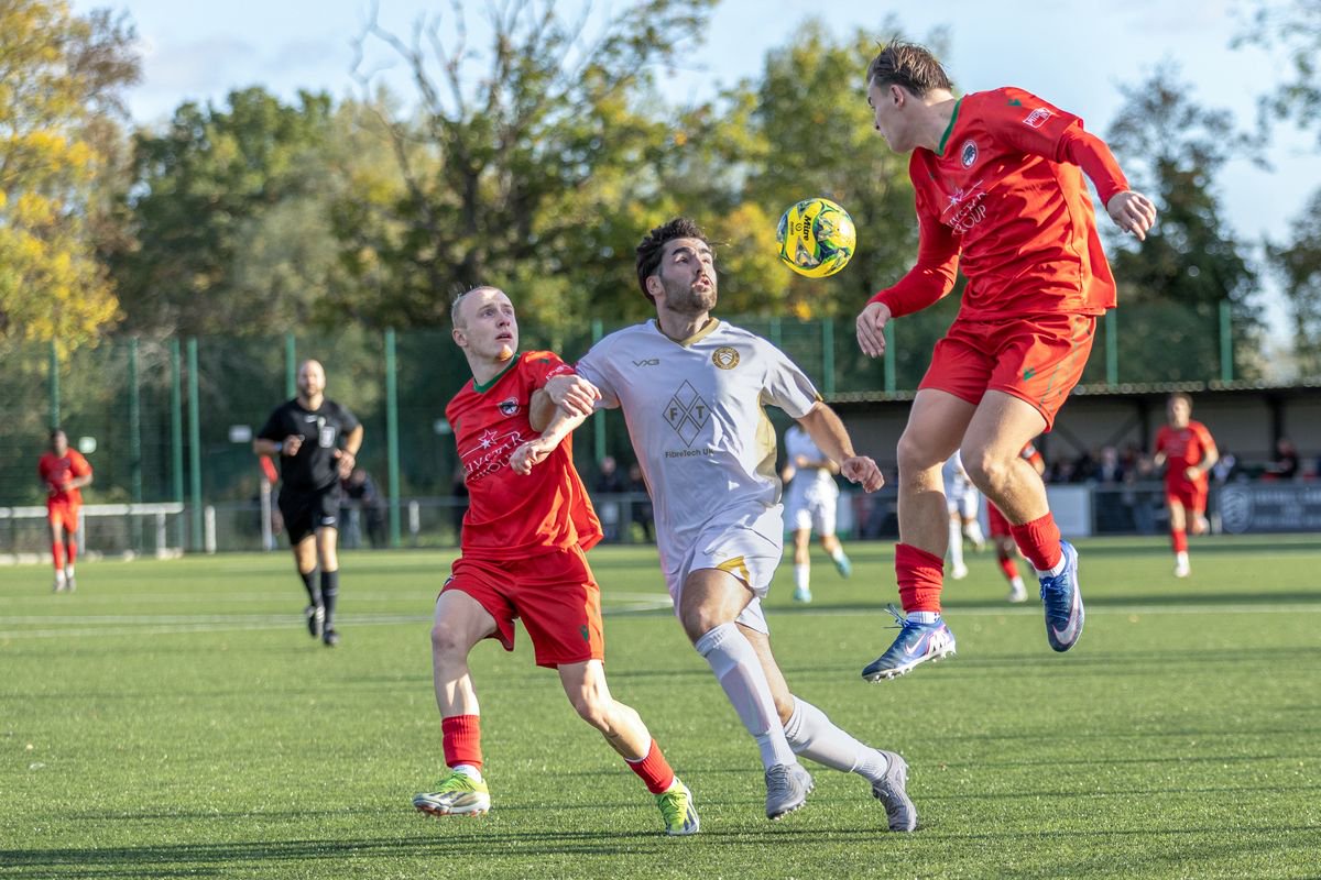South Park's George Vincent (r) beats the Whitstable midfield (Photo by Stuart McAlister)