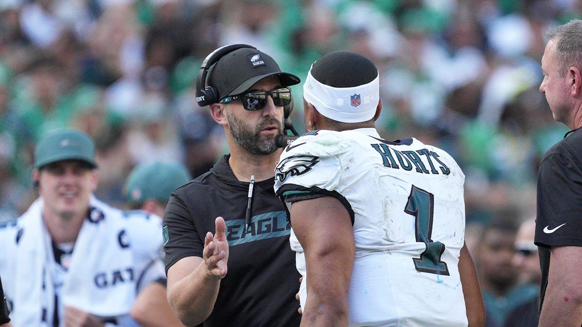 Philadelphia Eagles quarterback Jalen Hurts (1) discusses a play with Philadelphia Eagles head coach Nick Sirianni during the game between the Los Angeles Rams and the Philadelphia Eagles on Sept. 21, 2025 at Lincoln Financial Field in Philadelphia, Pennsylvania.