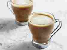 <p><b>Flat White: </b>A flat white is a coffee drink consisting of espresso with microfoam (steamed milk with small, fine bubbles and a glossy or velvety consistency).<b> Photo Credit: </b>thespruceeats.com</p>