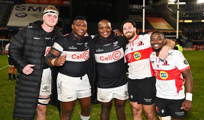 FILE - Ockie Barnard, Ntuthuko and Khutha Mchunu of the Cell C Sharks with ex-Sharks players Marius Louw, Captain and Sanele Nohamba of the Fidelity ADT Lions during the 2023 Currie Cup match at Kings Park.
