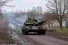 A tank T-64 drives by in Novoselivka Persha after driving out of Avdiivka, Ukraine