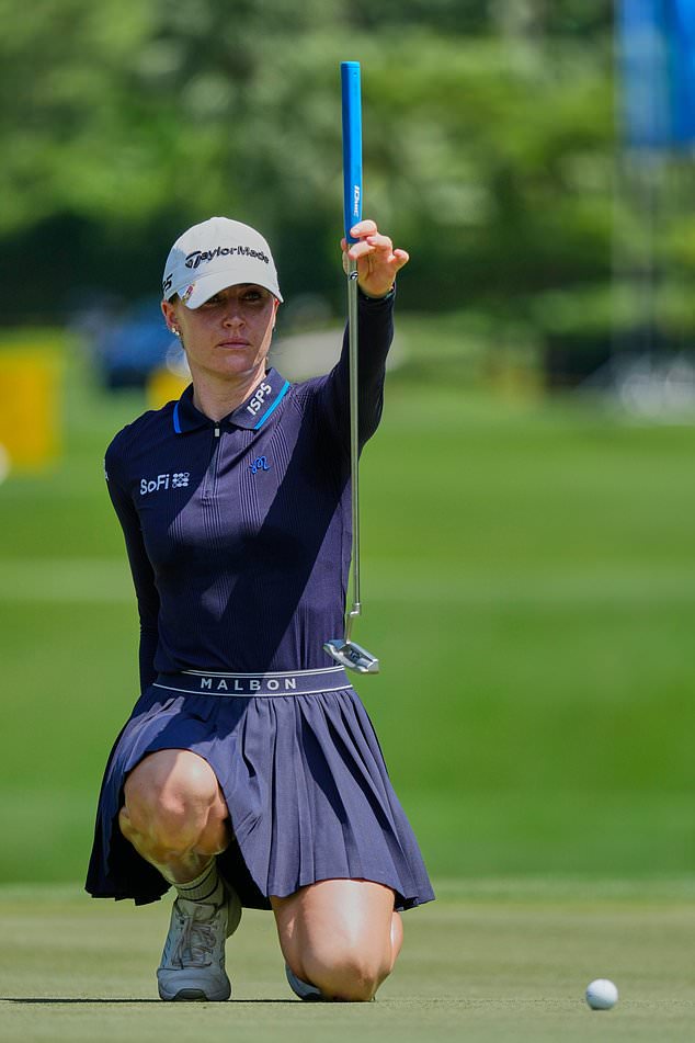 Charley Hull of England lines up a putt on the eighth hole during the second day of LPGA Maybank Championship in Kuala Lumpur, Malaysia, Friday, Oct. 30, 2026. (AP Photo/Vincent Thian)