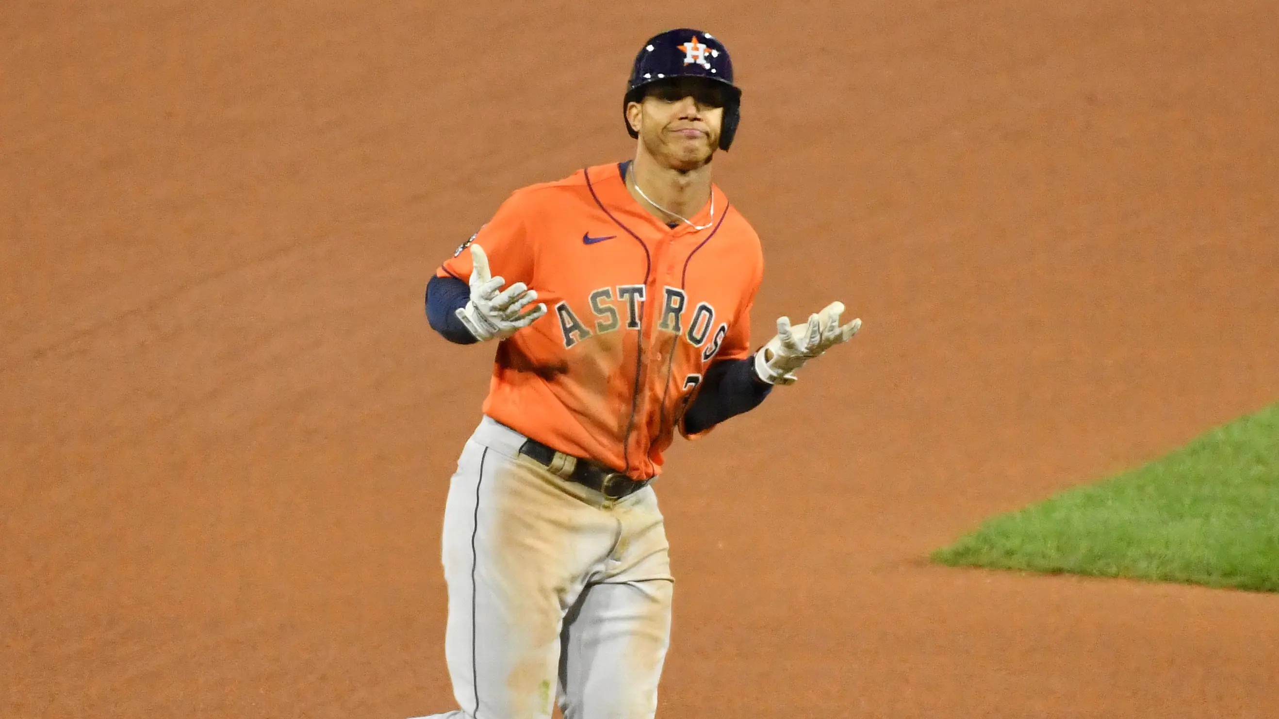 Houston Astros shortstop Jeremy Pena rounds third base shrugging