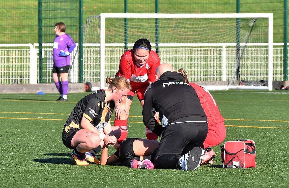 Concern for Charley Henderson from both sides after picking up a serious knee injury leading to the abandonment of the match. Photo: Ger Harley/Sportpix