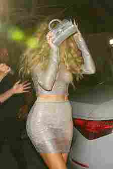 A photo of Khloe Kardashian hiding her face while leaving Beyonce’s birthday party