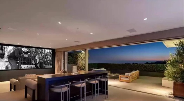 Trevor Noah’s living area opens out onto a roomy outdoor terrace. Photo: realtor.com