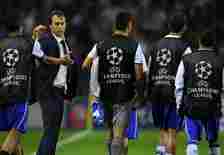 Porto's Spanish coach Julen Lopetegui (2L) congratulates his players at the end of the UEFA Champions League play-off second leg football match FC ...