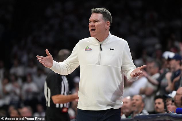 FILE - Arizona head coach Tommy Lloyd gestures during the first half of an NCAA college basketball game against Iowa State, March 2, 2026, in Tucson, Ariz. (AP Photo/Rick Scuteri)