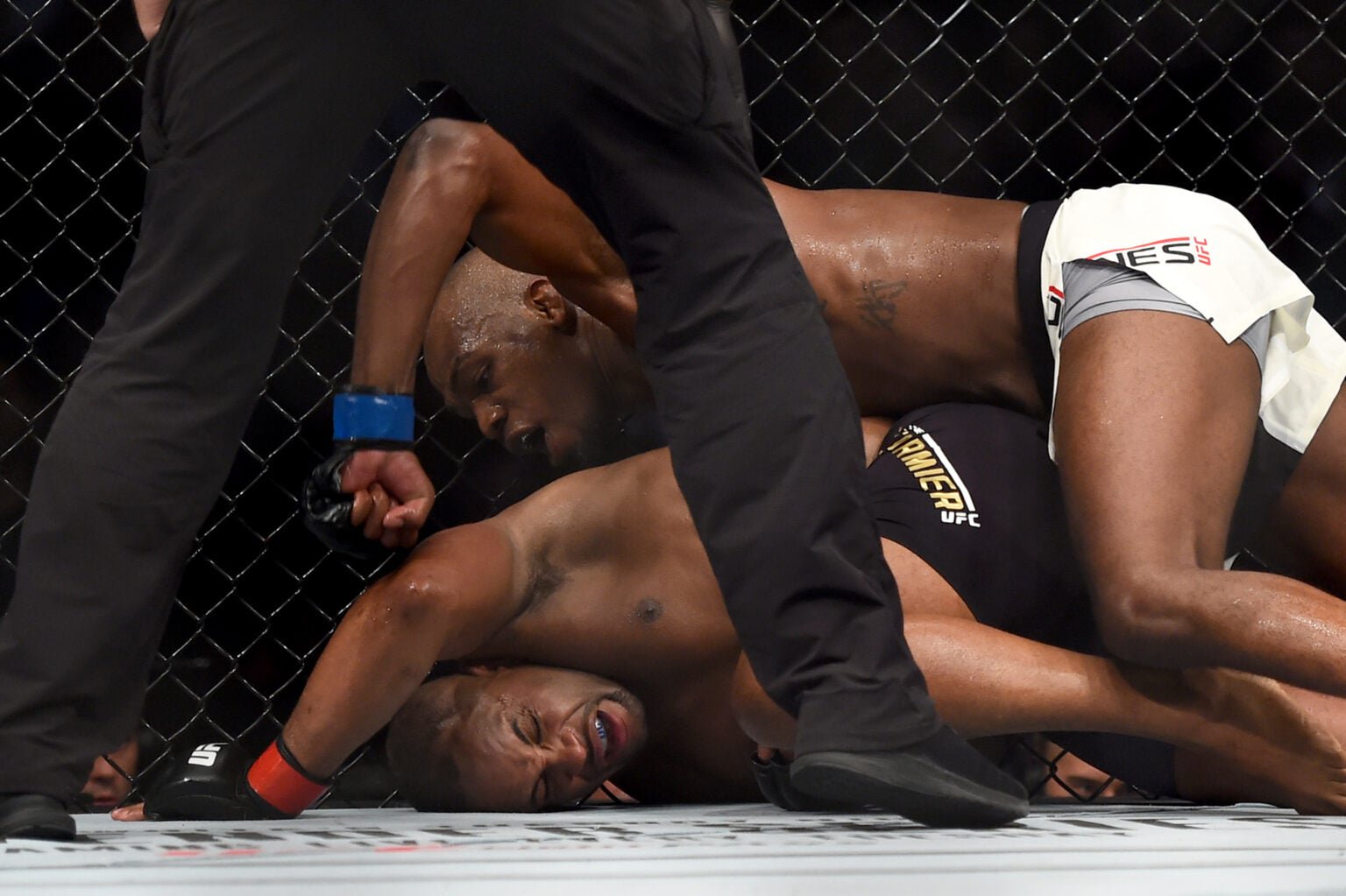 Jon Jones punches Daniel Cormier on the ground during their fight at UFC 214